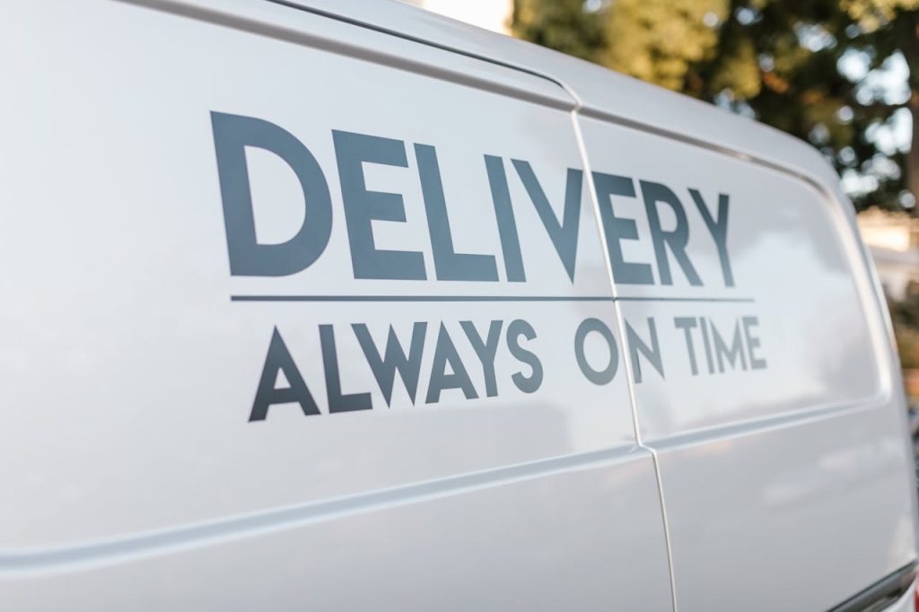 Close-up of delivery van with slogan Always On Time emphasizing timely service.